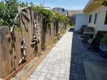 Enjoy the enclosed, wind protected back patio area with its amazing driftwood art.